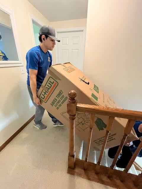 Moving team preparing items for loading and transport