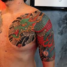 A different but cool concept is portraying the dragon as a rock star. Dragon Tattoos Half Sleeve Novocom Top