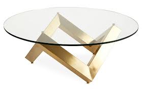 A simple round glass top resting lightly on sculpturally dynamic legs, the como embodies art and function. Como Coffee Table Gold One Kings Lane