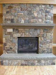 stone wall with woodstove and bluestone mantel hearth custom fireplace mantels he natural fireplaces faux hanging