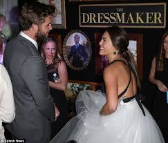 He made his american film debut opposite miley cyrus in the last song and from there has been in films such as the hunger games, independence day: Olympia Valance At The Dressmaker Premiere In Sydney After Calling Greg Cannell Her Husband Daily Mail Online