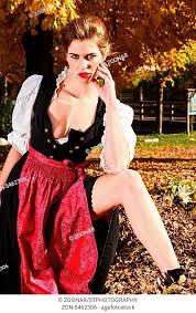 Schöne sexy Frau in einem traditionellen Dirndl posiert im Freien in einem  bunten Herbst Park mit..., Stock Photo, Picture And Rights Managed Image.  Pic. ZON-5462306 | agefotostock