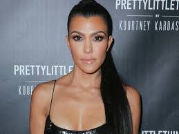 The reality star shared a photo of herself and the rocker holding. Kourtney Kardashian Implies She Wants Another Baby