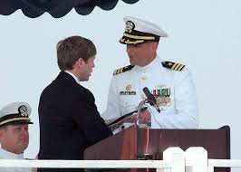 Jacksonville, Florida Mayor, the Honorable John Peyton, presents the key to  the city to the guided-missile submarine USS Florida (SSGN 728) commanding  officer, during her return to service ceremony.