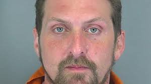 Bank robbery suspect charged