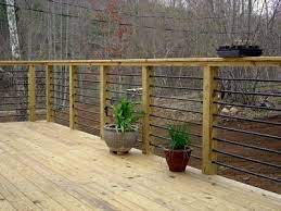 Choose from aluminum pickets, glass panels or mix both for a unique custom look. Rebar Railing Dark Color And Faded Wood Color Of Decking Material Design Is Pretty Close To What I Want Building A Deck Diy Deck Deck Railings