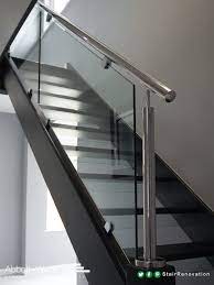 An Open Tread Black Oak Staircase With Steel Rail Glass Balustrade Glass Risers Add To The Feeling Staircase Design Glass Railing Stairs Glass Stairs Design