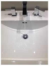 warm water drains slowly from bathroom sink