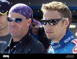 Australian cricketer Shane Warne with Benetton driver Jenson Button before  Grand Prix at Silverstone. The Formula 1 race is expected to draw about  100,000 spectators Stock Photo