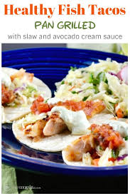 Tilapia is grilled until flaky and then served with a spicy mayonnaise sauce and crispy cabbage slaw in these delicious baja fish tacos. Healthy Fish Tacos Wild Caught Cod Fish With Slaw Avocado Cream