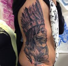 Black And Grey Tattoo Artists Edmonton Black And Grey Shade Rib Piece Female Skull Tattoo Wearing Headdress With Flowers Edmonton Realistic Tattoo Artist