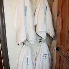 Repurposed vintage towel dispenser shelves. Numbered Towels Design Ideas