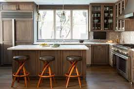 Therefore, if you have a relatively small kitchen with a natural source of lighting, white kitchen cabinets can help brighten it, offering an illusion of a larger space. Pros And Cons Painted Vs Stained Kitchen Cabinets Kitchen Sink Design White Kitchen Design Kitchen Design Small