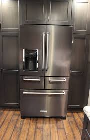 I personally love that black stainless steel kitchen appliances look warm, inviting and less industrial. Durasupreme Peppercorn Kitchen With Cambria Tops And Black Stainless Appliances Transitional Kitchen Other By Village Home Stores Houzz