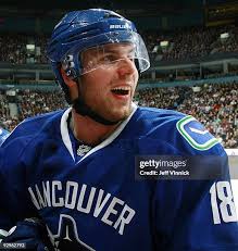 Andrew Raycroft of the Vancouver Canucks makes a save during their... News  Photo