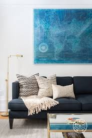 Blue Sofa And Blue Map With Gold Accents In The Living Room Blue Couch Living Trendy Living Rooms Couches Living Room