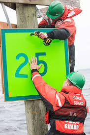 Petty Officer 3rd Class Benjamin Lassen holds a new