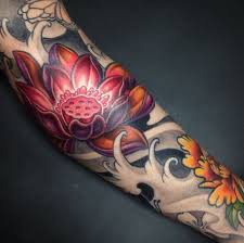 Amazing Japanese Tattoo Design With Lotus Tattoo Design In Hand Tattoo Ideas Mas Lotus Tattoo Design Japanese Tattoo Designs Tattoo Styles