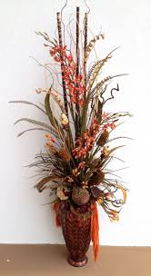 Features brown hydrangeas around the container base, highlighted with tall cream. Dried Arrangement Designed By Arcadia Floral Home Decor Dried Flower Arrangements Artificial Floral Arrangements
