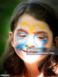 Girl With Painted On Forehead High-Res Stock Photo