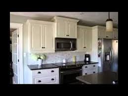 white kitchen cabinets with black
