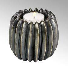 Stories about candle holders including candlesticks and candelabrums created by architects and designers. Tabeo Candle Holder Aluminium Bronze Antique H 8 Cm D 9 Cm