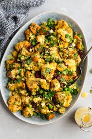 Shredded carrot salad with raisins & walnuts. Curry Roasted Cauliflower Sweet Potato Salad Whole30 Vegan Gluten Free Ambitious Kitchen
