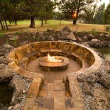 Fire glass is a breathtaking option for an outdoor fire pit design. Garden Circular Stone Seating With Sunken Fire Pit Backyard Garden Outdoor Large Garden Stone G Rustic Fire Pits Outside Fire Pits Outdoor Fire Pit Designs