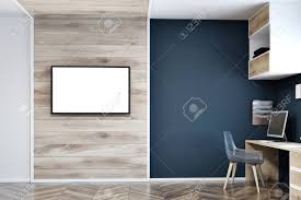 If you use wood for the shelves, desk or chair, then you'll add a bit of texture to the office. Modern Home Office Interior With Dark Blue White And Wooden Stock Photo Picture And Royalty Free Image Image 98027951