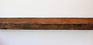 We can craft a custom mantel for your fireplace from aged wood. Amazon Com Parkco Rustic Fireplace Floating Mantel Shelf Rustic Reclaimed Barn Wood Wall Decor Mounting Hardware Included 66 W X 5 D X 2 75 H Home Kitchen