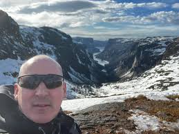 Hi all! I just wanted to introduce myself and share a photo I took last  April. The background is the Western Brook Gorge which is in the Gros Morne  National Park in