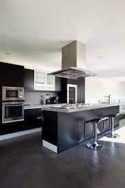 Modern design started around world war i and featured flat surfaces, geometric forms, and minimal ornamentation. 52 Dark Kitchens With Dark Wood Or Black Kitchen Cabinets Modern Kitchen Design Black Kitchens Kitchen Design