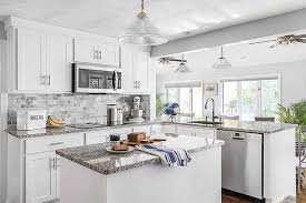 Modern design lacquer finish white waterfall island design kitchen cabinet with marble worktop. White Kitchen Cabinets And Countertops A Style Guide
