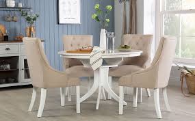 The cleary dining table's oval construction and sturdy pedestal base make it easy to add dinner guests or host a buffet, and the white lacquer finish is. Hudson Round White Extending Dining Table With 4 Duke Oatmeal Fabric Chairs Mysmallspace Uk