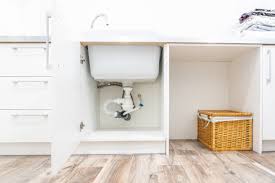 260 plumber under sink stock photos