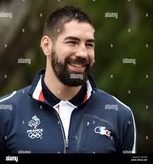 French handball player Nikola Karabatic (L), flanked by his lawyer Jean-Robert  Phung at the Montpellier courthouse for the trial of 16 people charged with  fraud over alleged match-fixing in Montpellier, France on