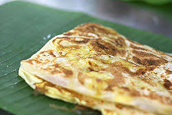 Roti canai plain, with egg and onion, with cheese and tomato, with banana and nuttella, with spring onion, red chilli, cheese and egg. Roti Canai Wikipedia