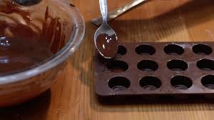 Chocolate molds have been around since chocolate consumption moved from predominately drinking chocolate to filling the chocolate cavity: Homemade Chocolate Recipe In The Kitchen With Matt