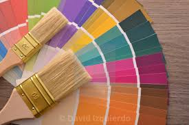 Brushes On Color Fan Chart On A Brown Wooden Table License