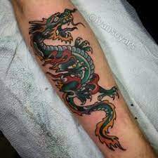 Discover The Meaning Behind Sailor Jerry S Famous Old School Tattoos From Drago Discover The Meaning Behind Sai Japanese Tattoo Tattoos For Guys Tattoos