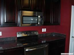 Black counters grey cabinets and white walls i think the first. Rhinetta Homes Photo Albums Red Kitchen Walls Red Kitchen Black Kitchen Cabinets