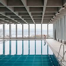 London Firm Acme Has Completed A Shopping Centre In Leeds England Featuring A White Latticed Swimming Pool Architecture Indoor Swimming Pools Swimming Pools