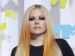 Avril Lavigne suffers major fashion mishap in mesh bodysuit and tartan mini  skirt | HELLO!
