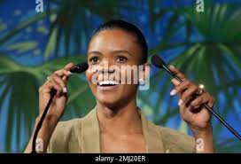 Candace Owens, director of urban engagement for Turning Point USA, right,  looks at Marion Marechal, niece of far-right leader Marine Le Pen, left, as  she arrives at the Convention of the Right,
