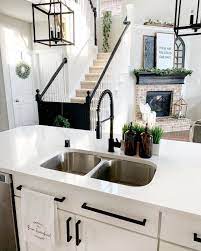 Find ideas here for bringing farmhouse style to your kitchen. Matte Black Pre Rinse Faucet Small Cottage Kitchen Black Kitchen Faucets Cottage Kitchen Design