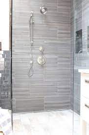 Textured finishes and graphic mosaic tile patterns are in. 40 Gray Shower Tile Ideas And Pictures Gray Shower Tile Shower Tile Bathroom Shower Tile