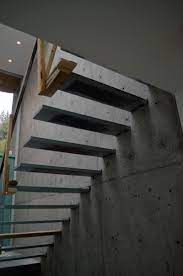 Steel Cantilevered Steps Attached To Concrete Wall Stairs Floating Stairs Cantilever Stairs