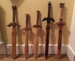 Kids Wooden Swords Some Legend Of Zelda Inspired The Last One Is In Progress Yet To Be Treated And Oiled Wooden Sword Wood Projects Wooden