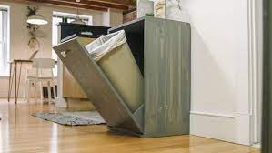 Drill a couple holes in the sides of can to prevent the suction you often deal with when pulling the bag out betcha didn't realize this island used to be kitchen cabinets. How To Make A Hidden Trash Can Cabinet Danmade Watch Dan Faires Make Reclaimed Wood Furniture Hgtv