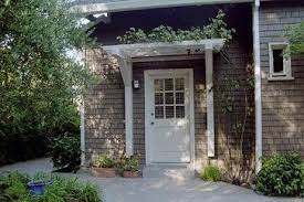 It S Official We Are The Slowest Home Renovators On The Planet I Generate Fun Home Improvement Ideas At A Light House Exterior Door Pergola Exterior Design